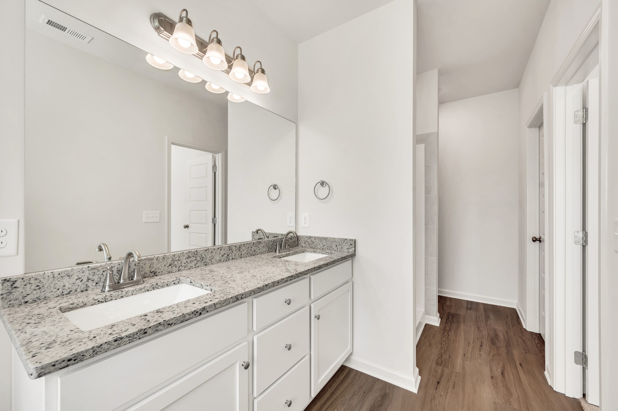 7091 Wiley Circle Fairview, TN 37062 - Photo 25 of 32 a bathroom with a granite countertop sink and a mirror