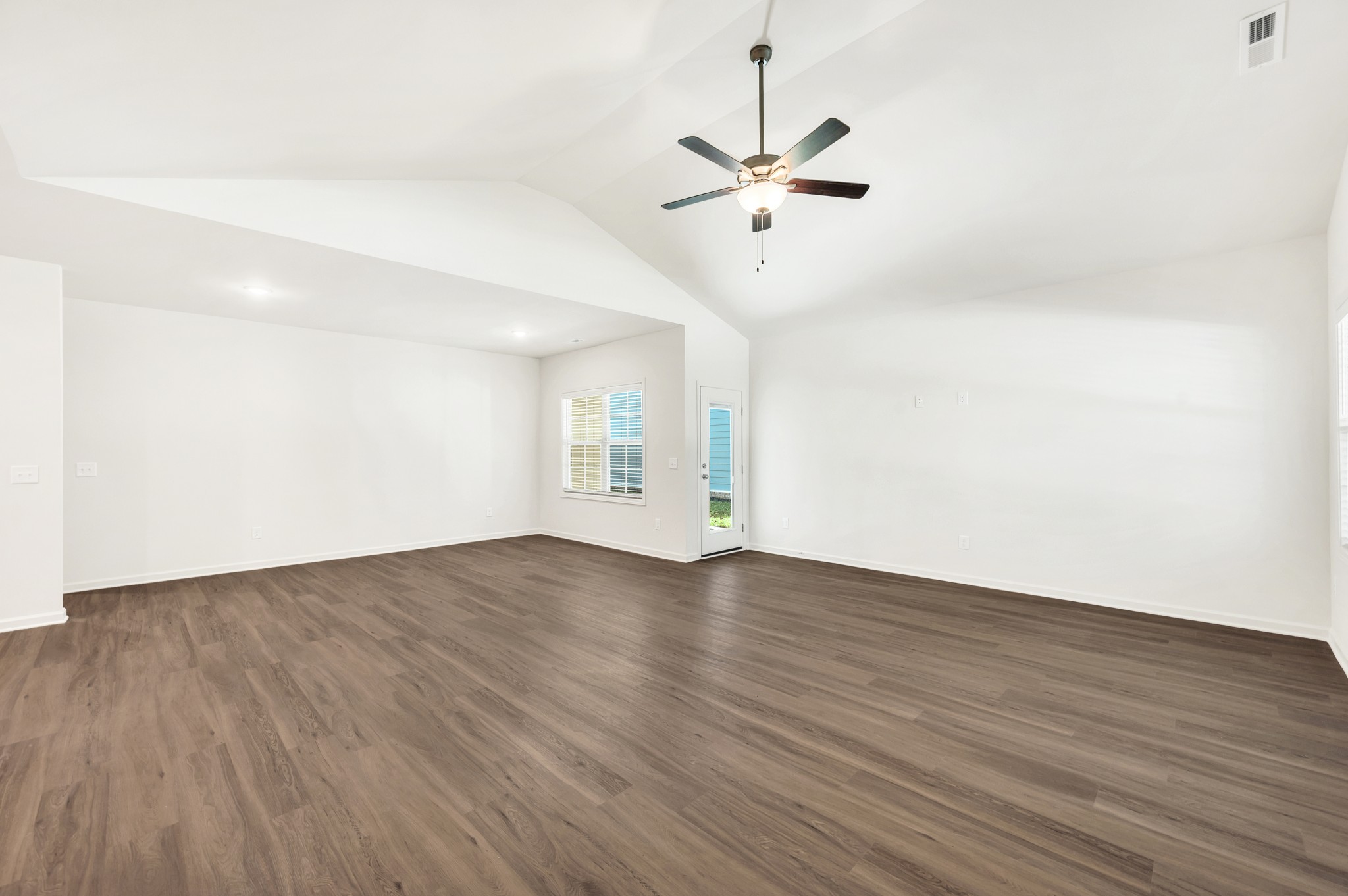 7091 Wiley Circle Fairview, TN 37062 - Photo 5 of 32 a view of an empty room with wooden floor and a window