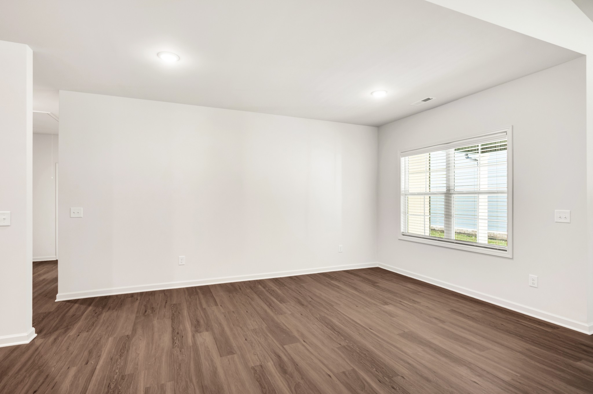 7091 Wiley Circle Fairview, TN 37062 - Photo 8 of 32 an empty room with wooden floor and windows