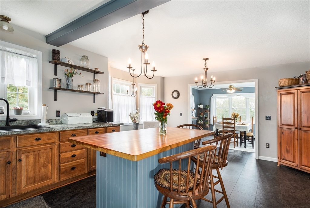 2 South County Road Leyden, MA 01301 - Photo 12 of 42 a dining table with wooden floor and stainless steel appliances