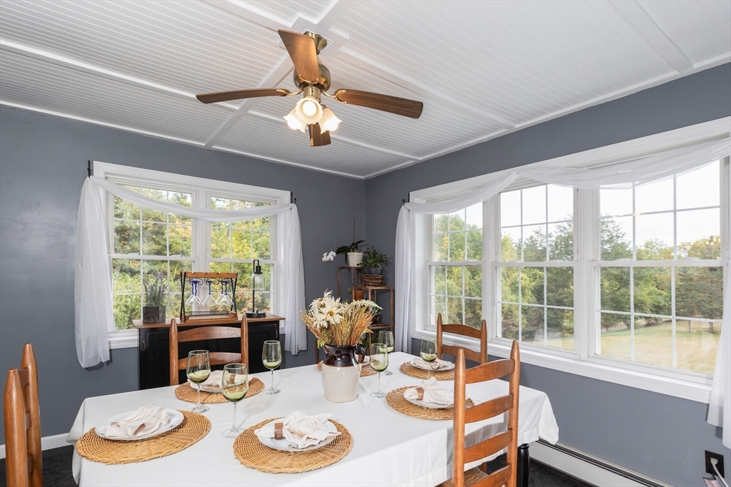 2 South County Road Leyden, MA 01301 - Photo 15 of 42 a view of a dining room with furniture large windows and wooden floor