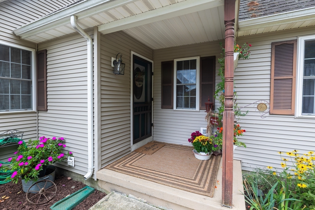 2 South County Road Leyden, MA 01301 - Photo 6 of 42 a house with a flower vase and flowers