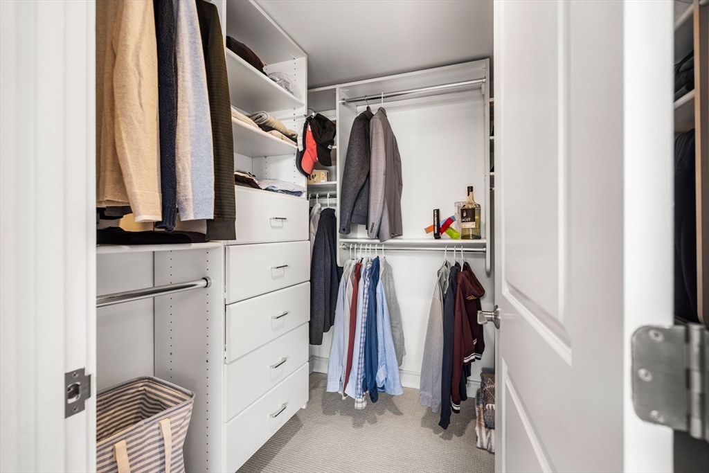 201 Newbury Street, Unit 405 Boston, MA 02116 - Photo 8 of 17 a view of walk in closet with clothes and shoes