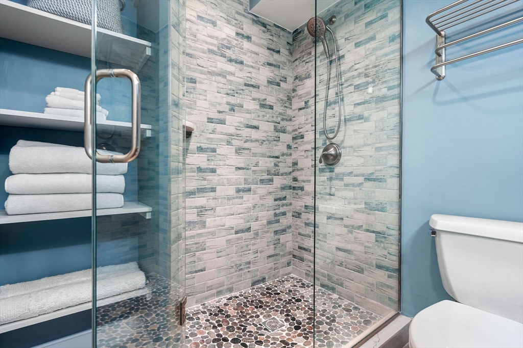 201 Newbury Street, Unit 405 Boston, MA 02116 - Photo 9 of 17 a bathroom with a toilet and a shower