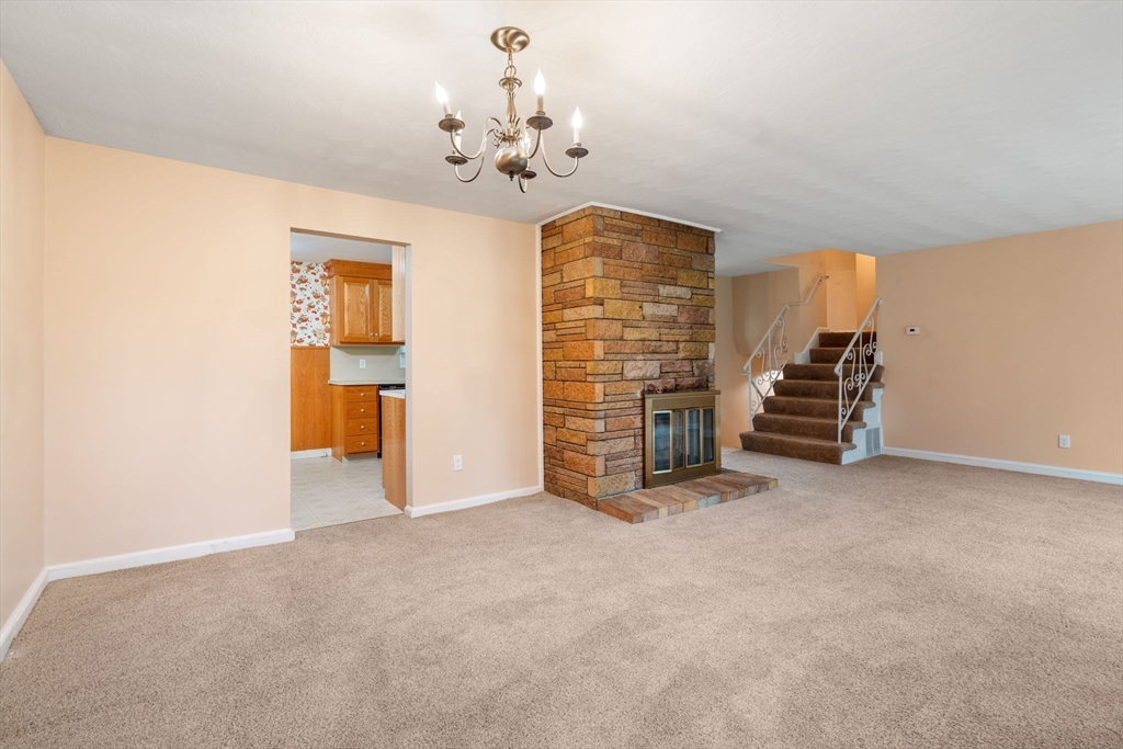 18 Royce Road Framingham, MA 01701 - Photo 4 of 30 a view of an empty room with a fireplace