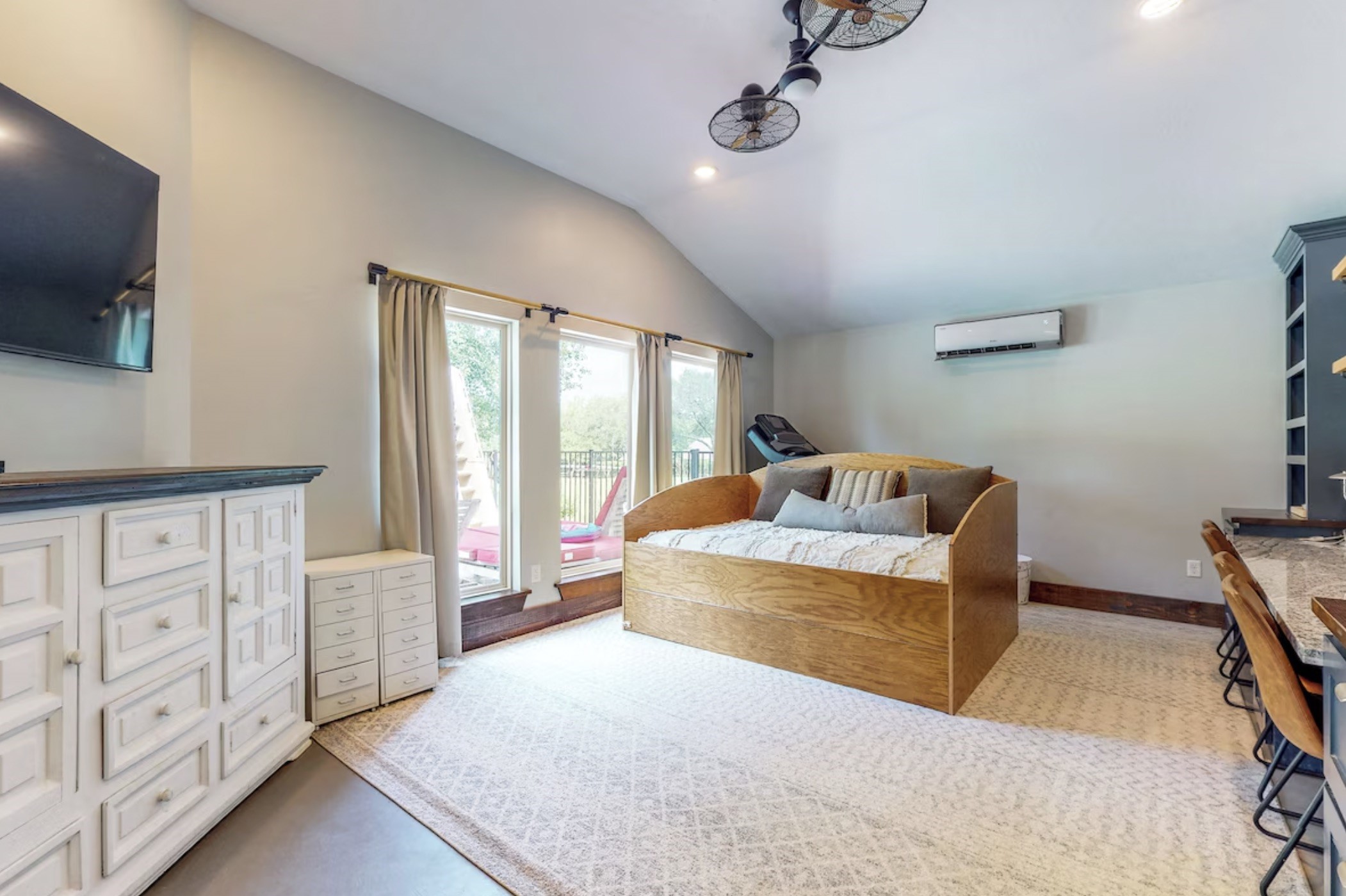 30819 Quinn Road Tomball, TX 77375 - Photo 19 of 30 a bedroom with furniture and flat screen tv