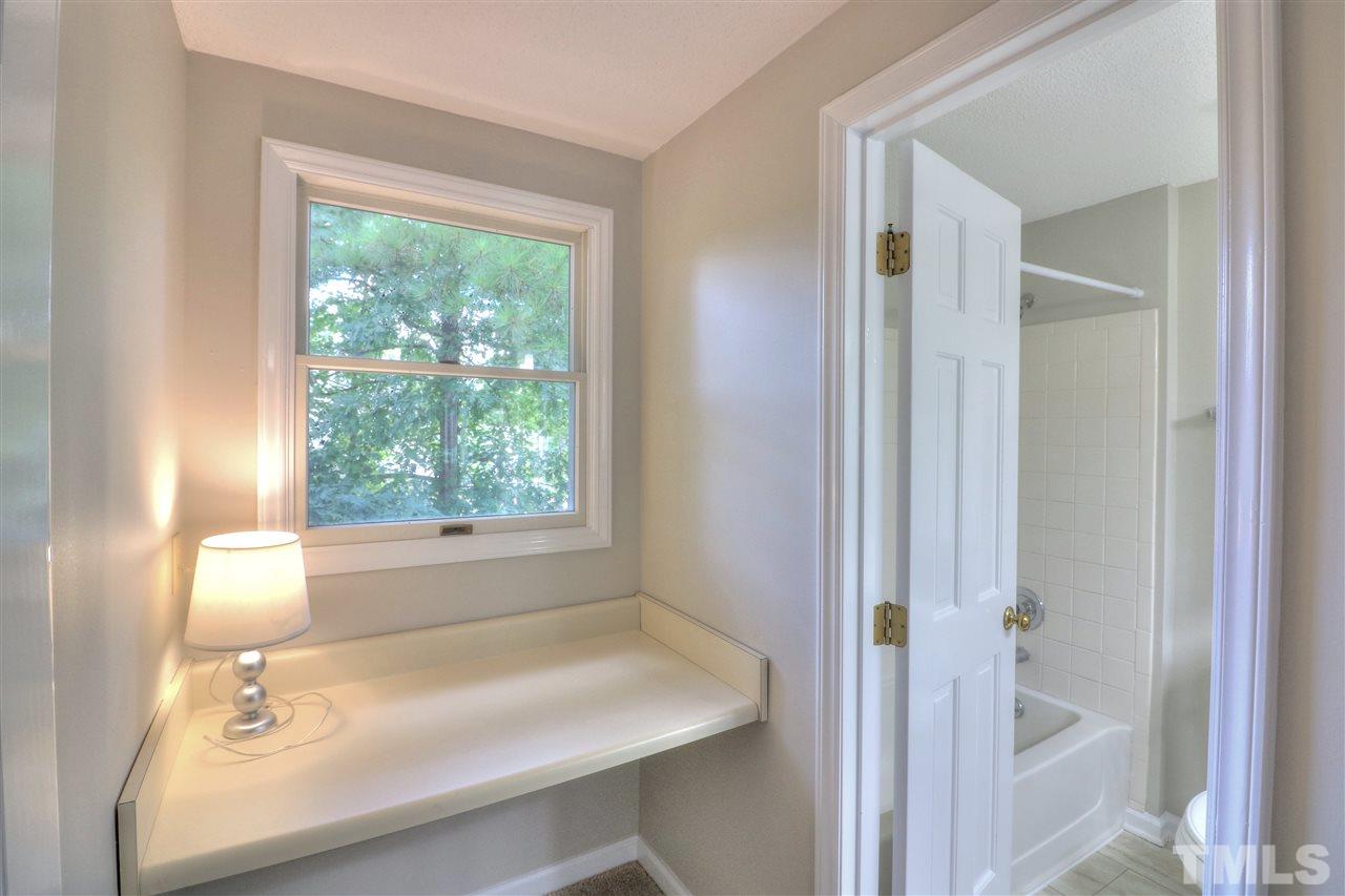 1909 Summerlyn Court Raleigh, NC 27609 - Photo 13 of 24 a bathroom with a sink and a bathtub