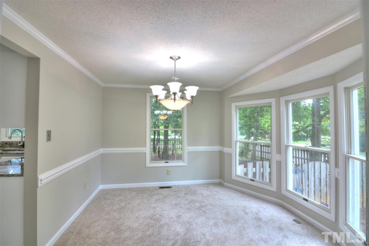 1909 Summerlyn Court Raleigh, NC 27609 - Photo 3 of 24 a view of an empty room with a window