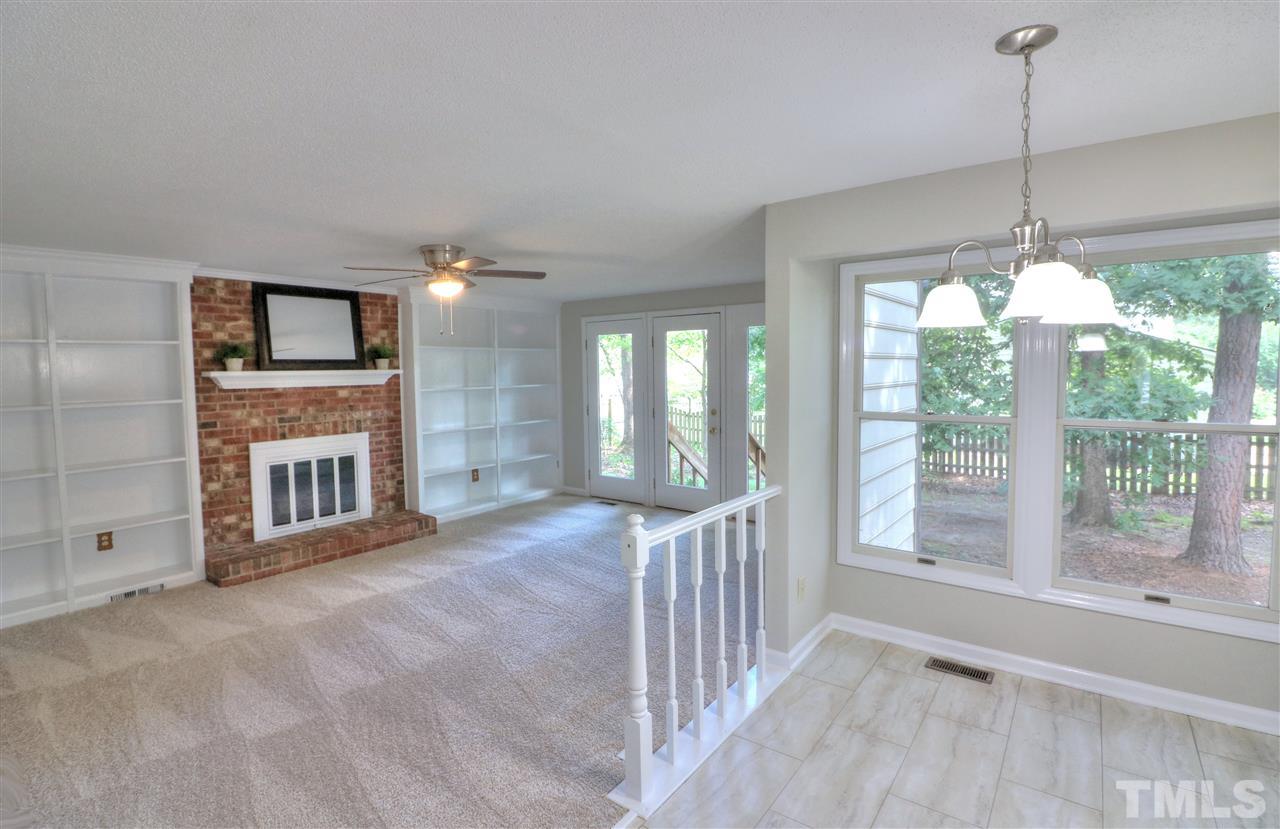 1909 Summerlyn Court Raleigh, NC 27609 - Photo 7 of 24 a view of a livingroom with furniture wooden floor and window