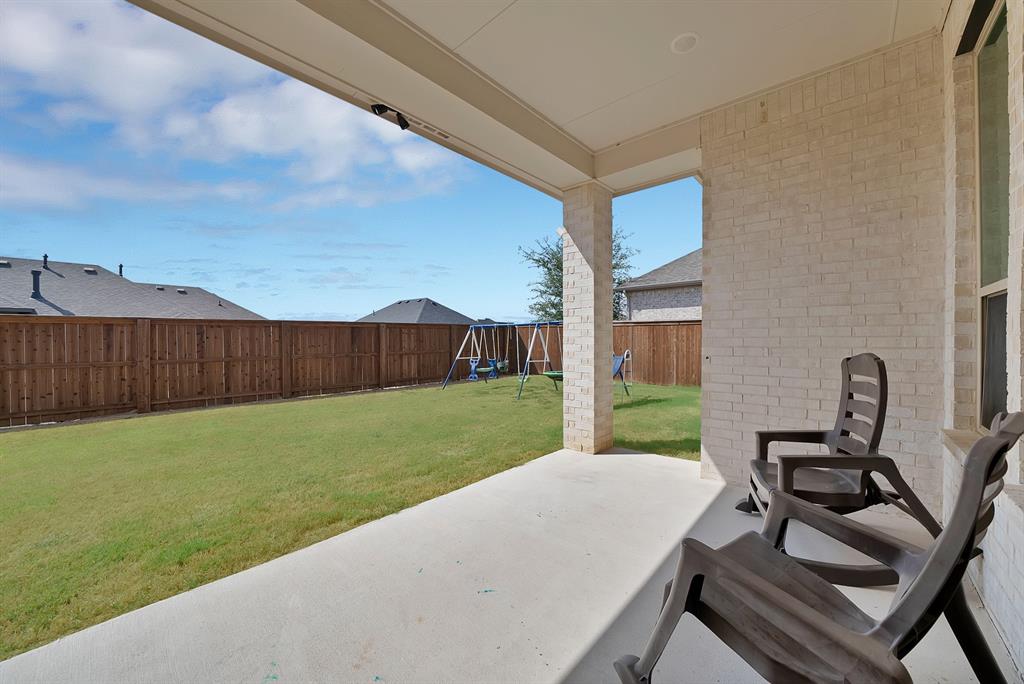 4222 Crown Run Road Midlothian, TX 76065 - Photo 37 of 40 Covered patio with a concrete surface, white brick exterior, and a spacious green lawn