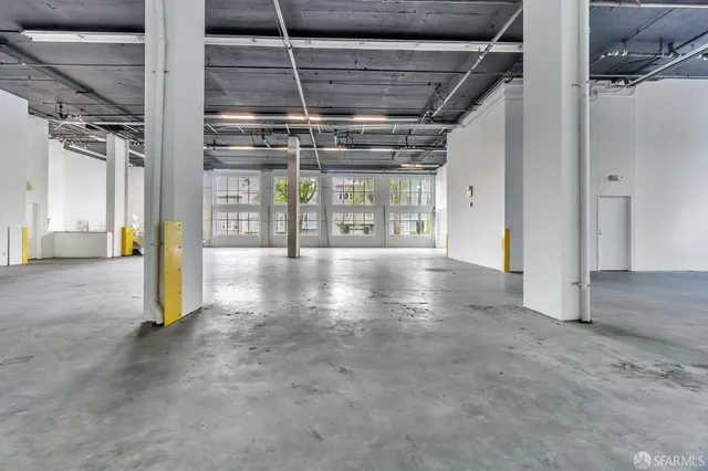 a view of a room with wooden walls