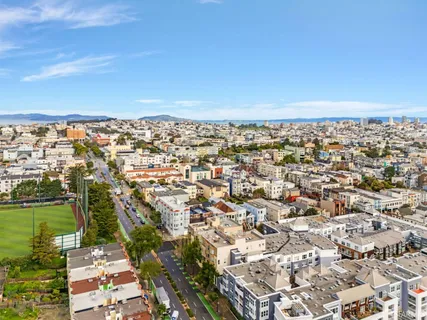 a view of a livingroom with a fireplace and window