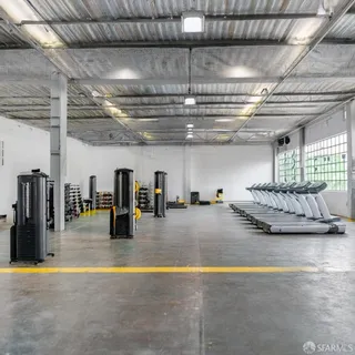 a view of gym area with gym equipment and floor to ceiling window