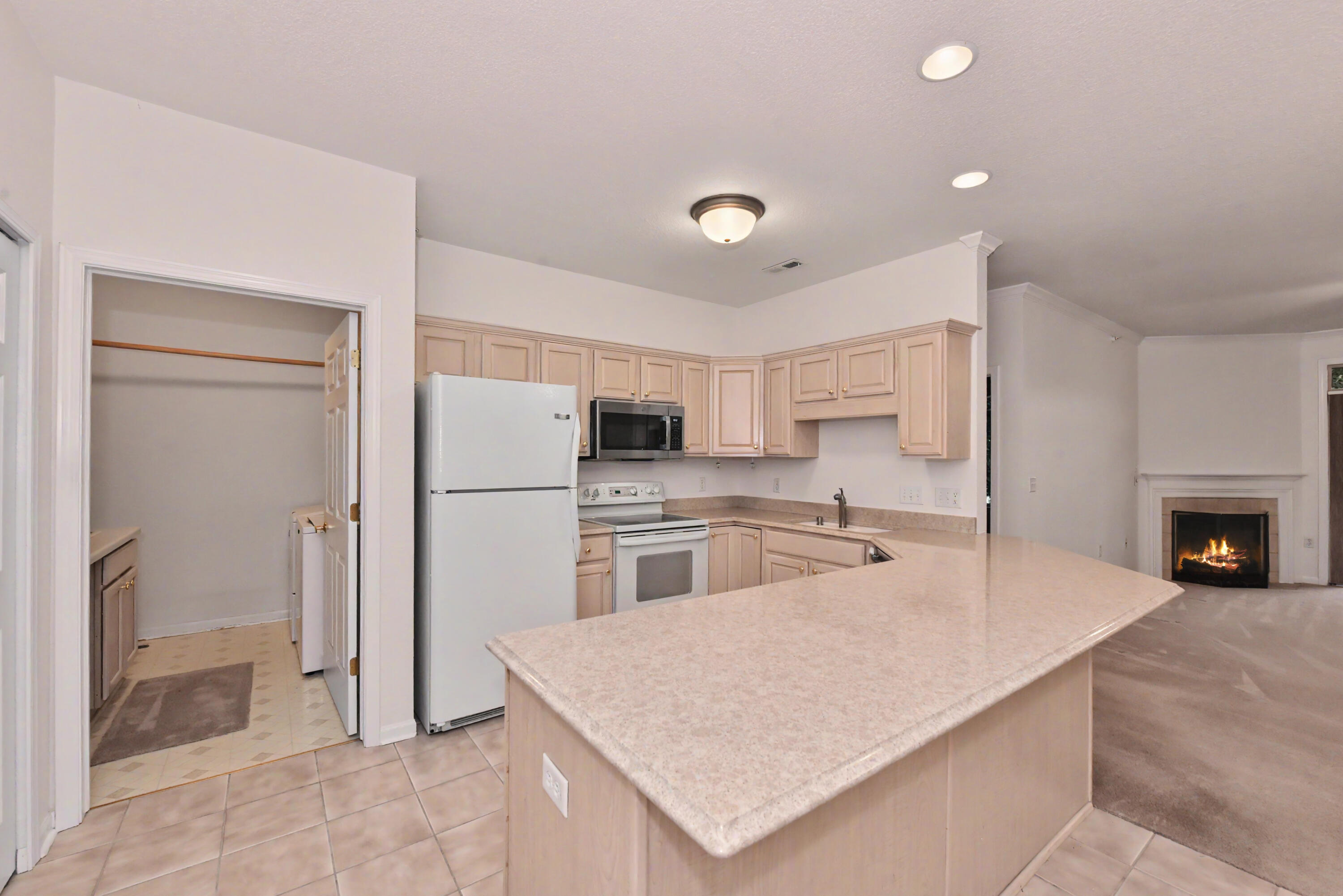 13050 West Bluemound Road, Unit 203 Elm Grove, WI 53122 - Photo 16 of 24 Laundry room with cabinets, counter and utility sink off kitchen