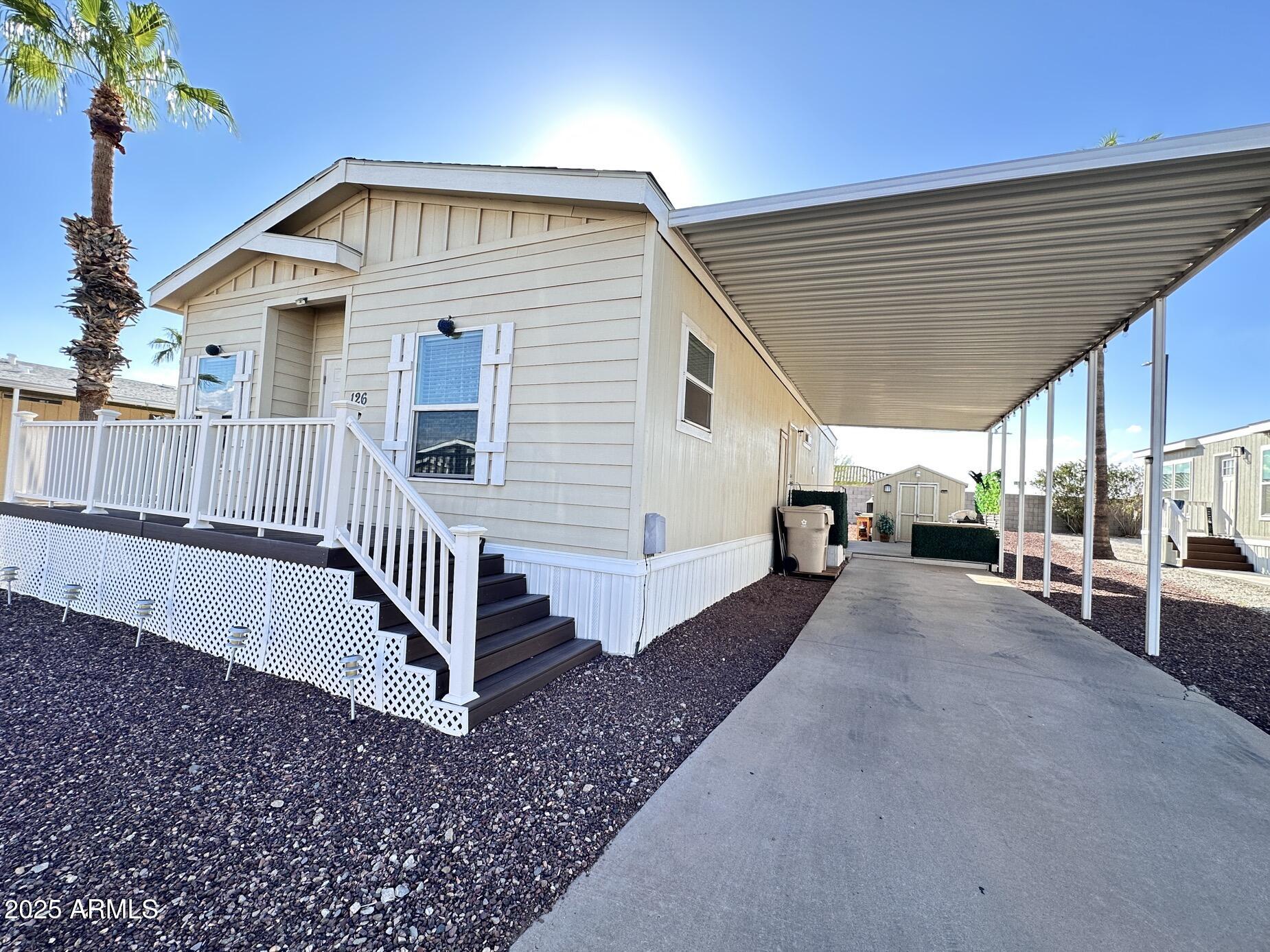 2000 South Apache Road, Unit 126 Buckeye, AZ 85326 - Photo 1 of 29 a view of a house with backyard and porch