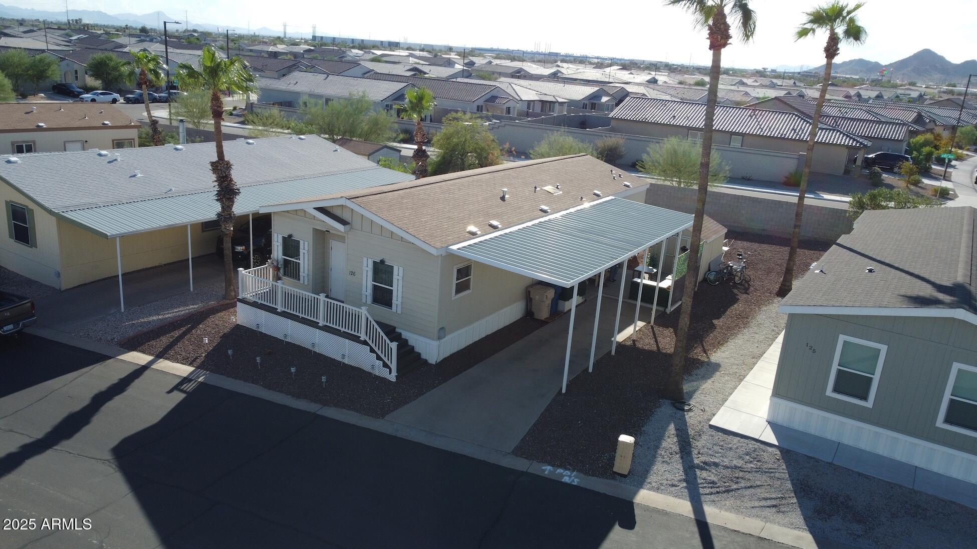 2000 South Apache Road, Unit 126 Buckeye, AZ 85326 - Photo 4 of 29 an aerial view of a house with a big yard