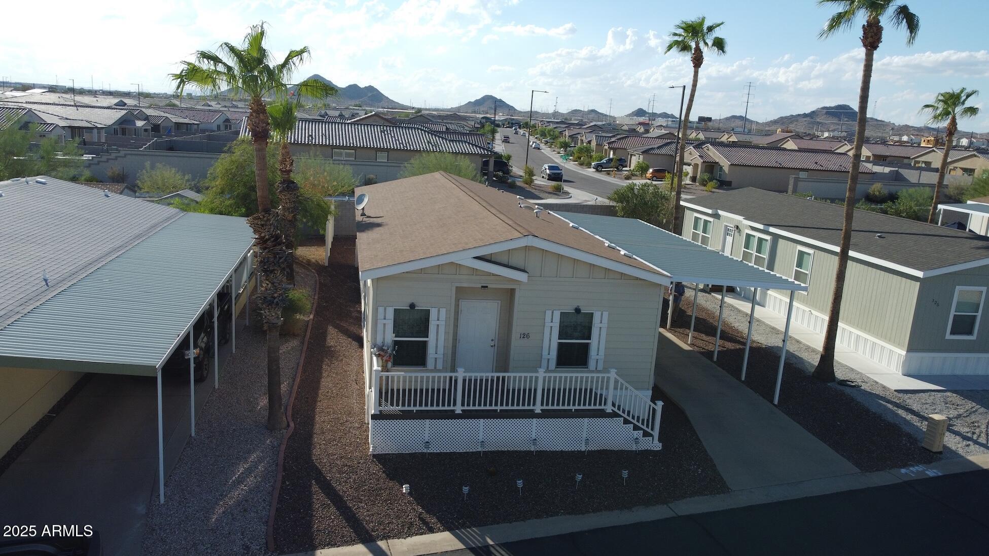2000 South Apache Road, Unit 126 Buckeye, AZ 85326 - Photo 5 of 29 a view of a house with a porch