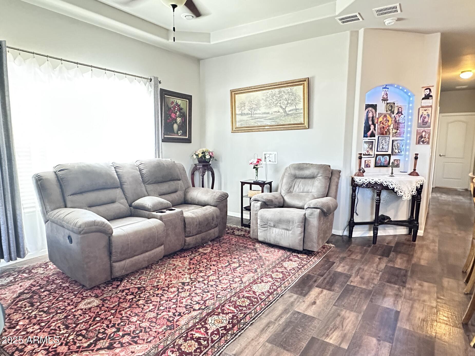 2000 South Apache Road, Unit 126 Buckeye, AZ 85326 - Photo 9 of 29 a living room with furniture and a rug