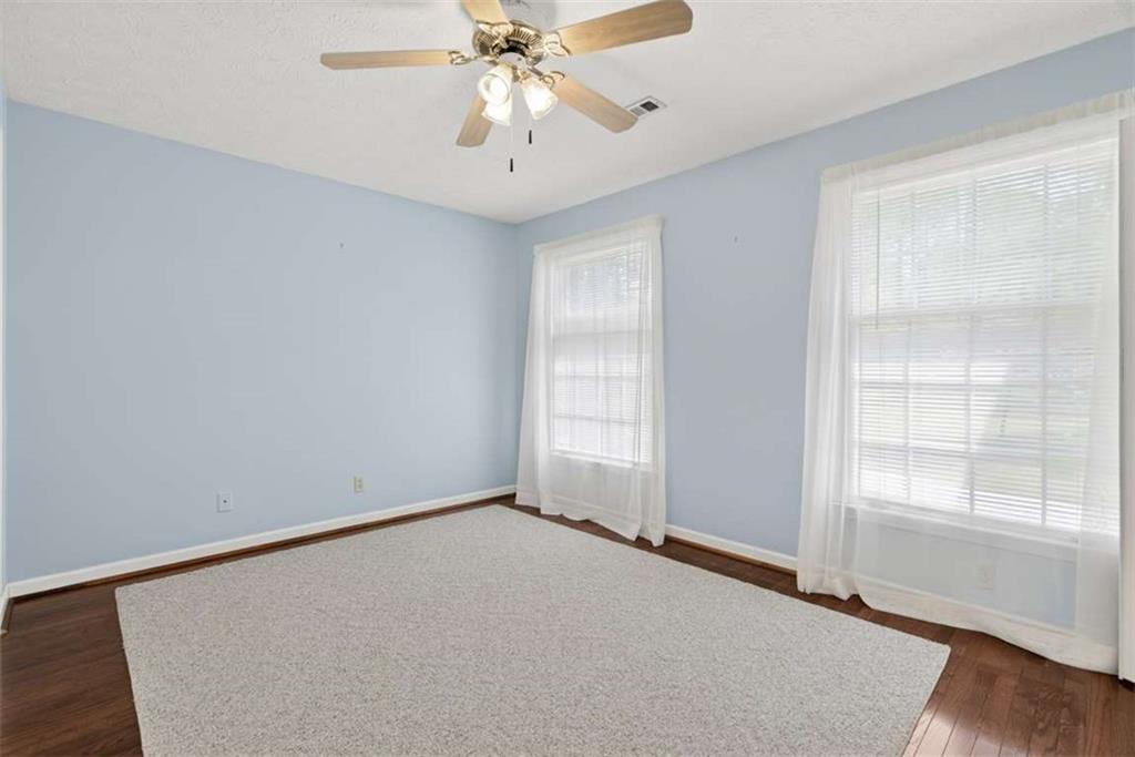 3035 Mt Zion Road Oxford, GA 30054 - Photo 39 of 99 an empty room with windows and fan