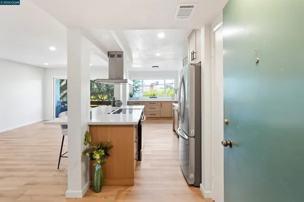 a view of a kitchen and living room
