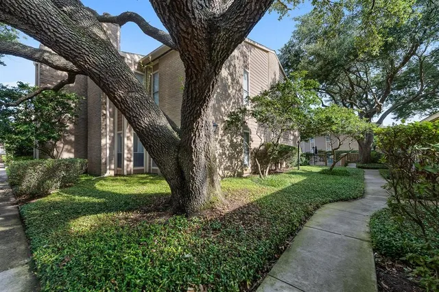 a swimming pool with outdoor seating and yard