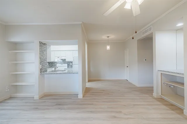 a view of kitchen and wooden floor