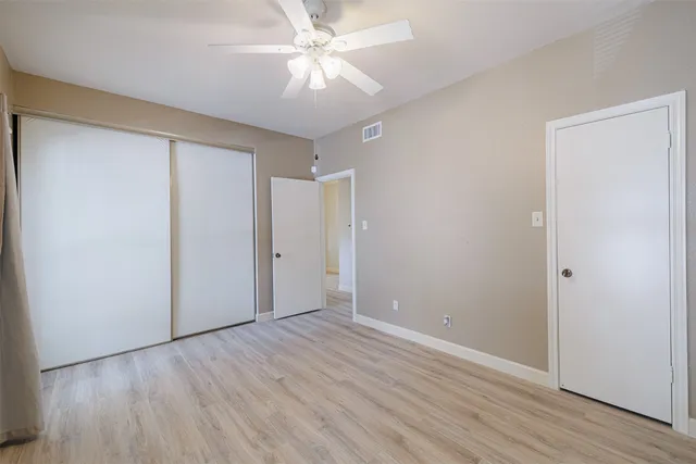a bathroom with a granite countertop toilet a sink and a bathtub