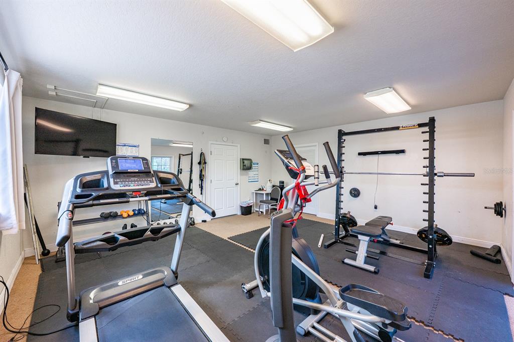 4224 Lake Underhill Road, Unit 8B5 Orlando, FL 32803 - Photo 23 of 40 a view of a room with gym equipment