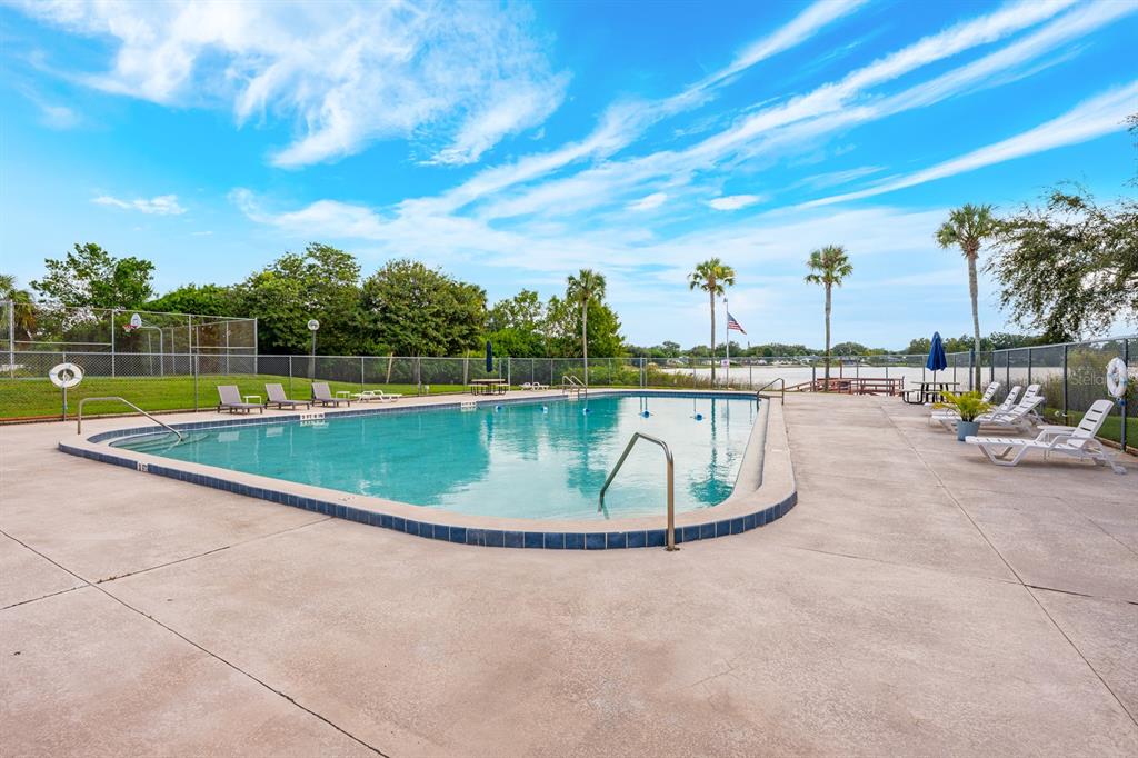 4224 Lake Underhill Road, Unit 8B5 Orlando, FL 32803 - Photo 29 of 40 a view of a swimming pool with a lake view