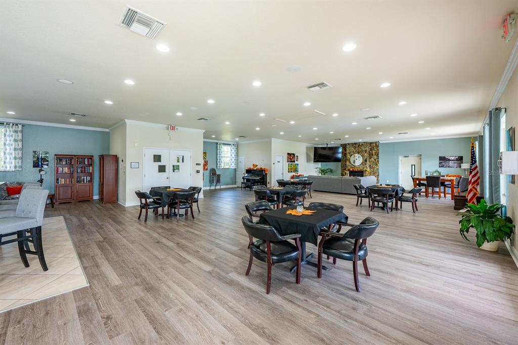 4224 Lake Underhill Road, Unit 8B5 Orlando, FL 32803 - Photo 35 of 40 a view of a dining area with furniture and wooden floor