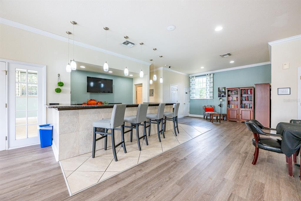 4224 Lake Underhill Road, Unit 8B5 Orlando, FL 32803 - Photo 38 of 40 a view of a dining room with furniture and wooden floor