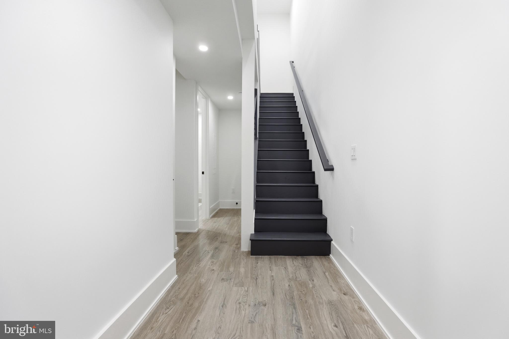 1140 Oates Street Northeast, Unit 101 Washington, DC 20002 - Photo 18 of 31 a view of a hallway with wooden floor and entryway