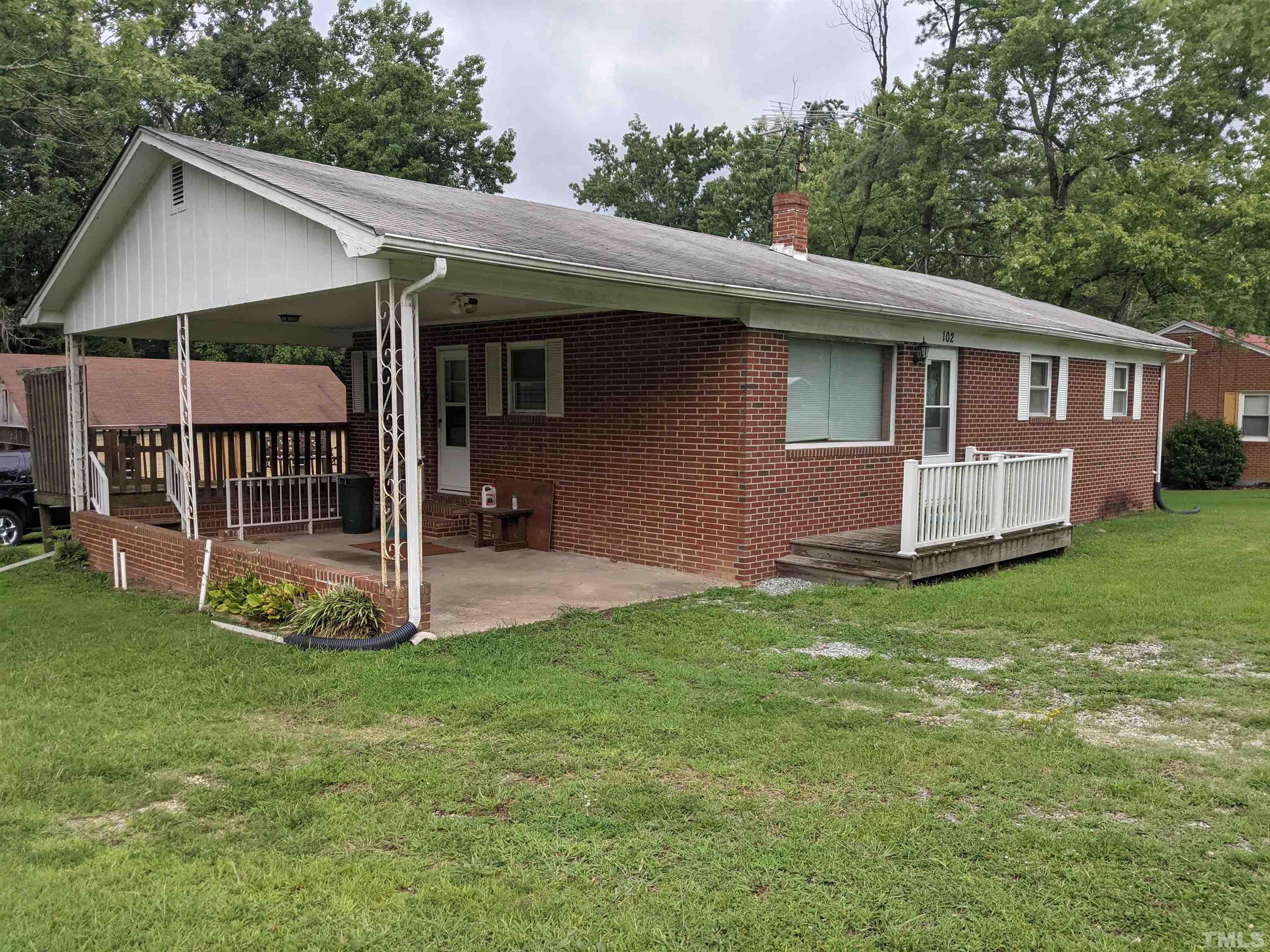 102 Dee Long Road Roxboro, NC 27574 - Photo 1 of 21 a view of a house with a yard and deck