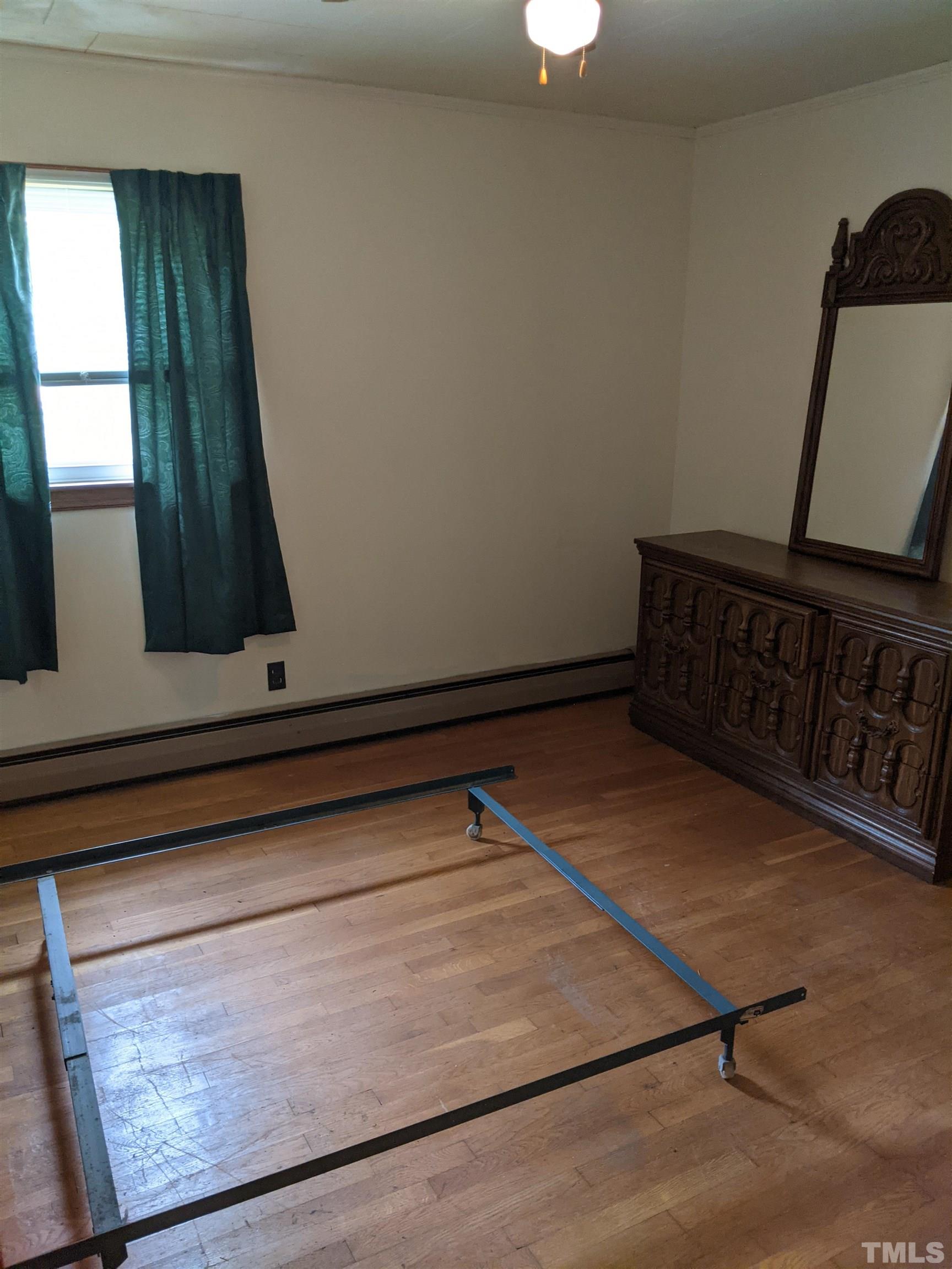 102 Dee Long Road Roxboro, NC 27574 - Photo 13 of 21 a view of a room with wooden floor