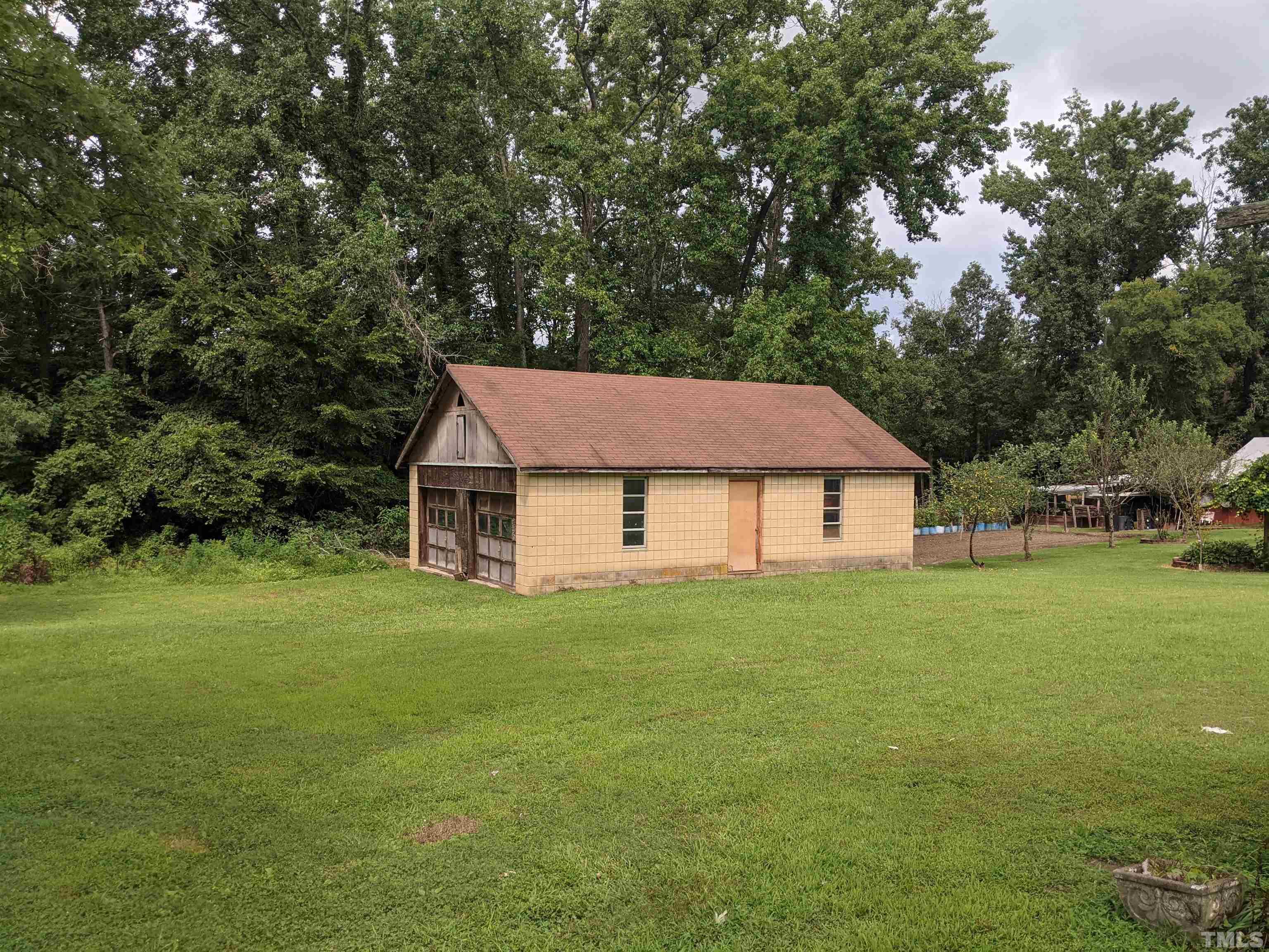 102 Dee Long Road Roxboro, NC 27574 - Photo 6 of 21 a house with a yard