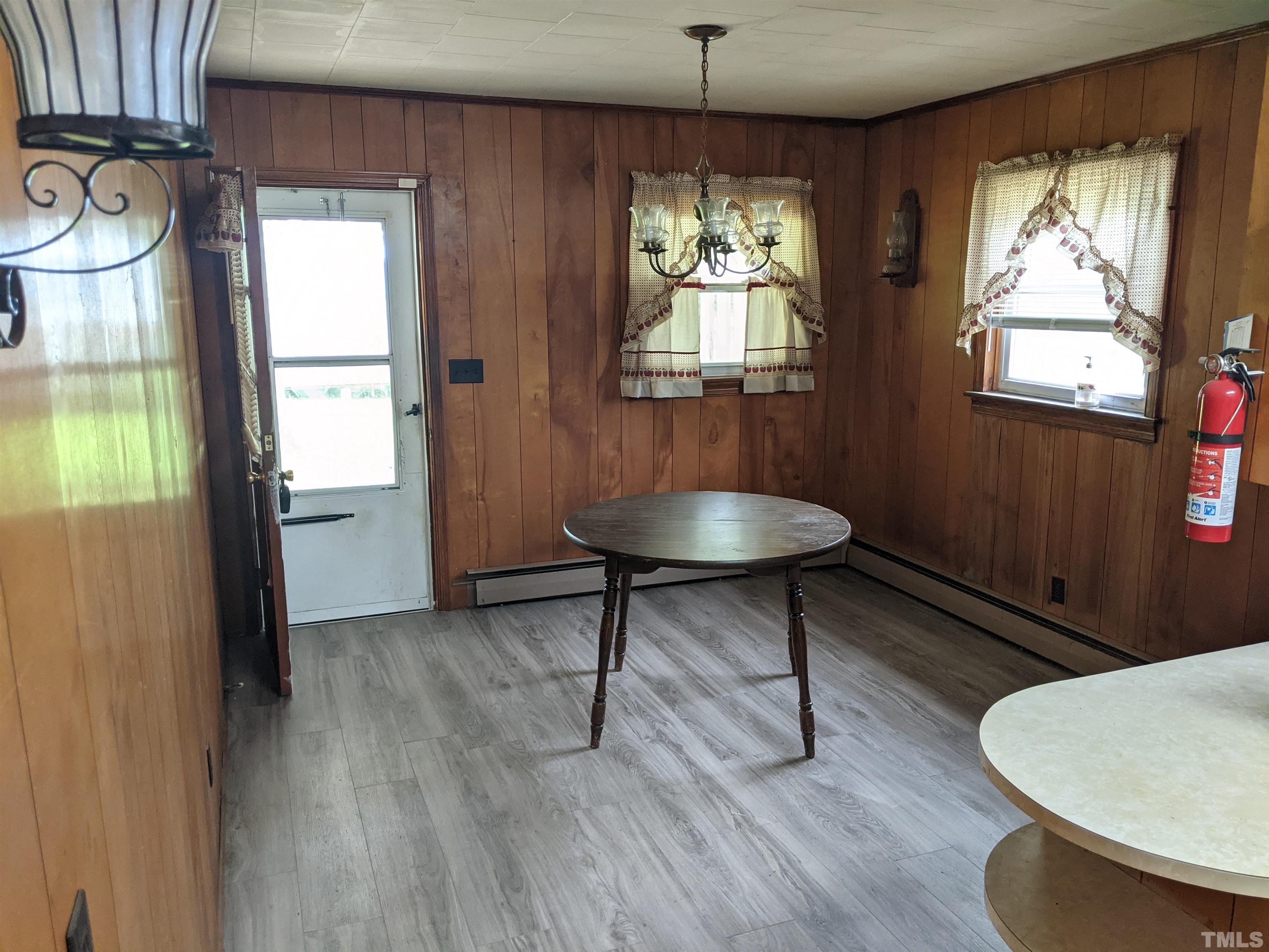 102 Dee Long Road Roxboro, NC 27574 - Photo 8 of 21 a view of a livingroom with furniture window and wooden floor