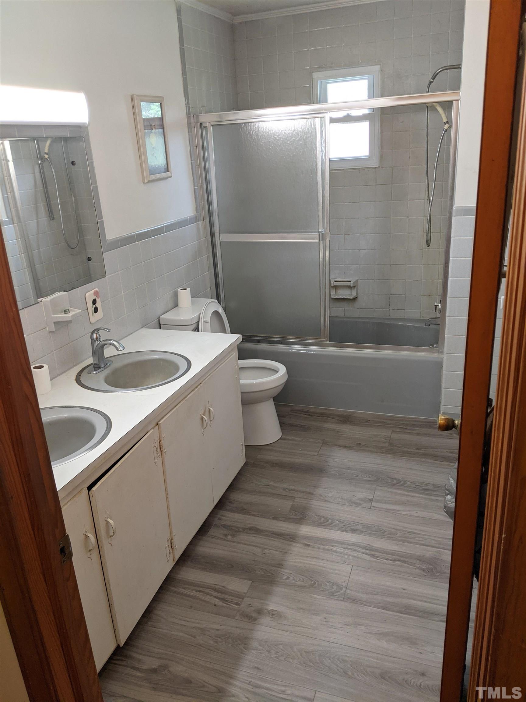 102 Dee Long Road Roxboro, NC 27574 - Photo 10 of 21 a bathroom with a sink toilet and shower