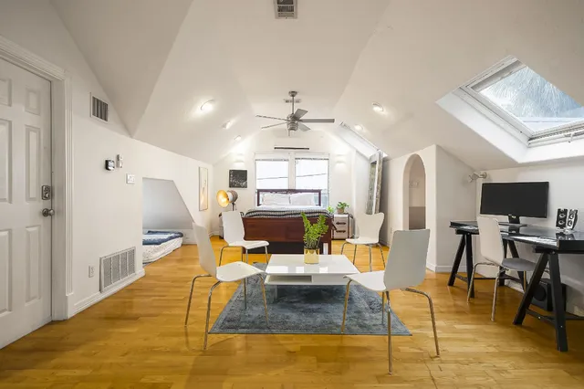 a living room with fireplace furniture and a flat screen tv