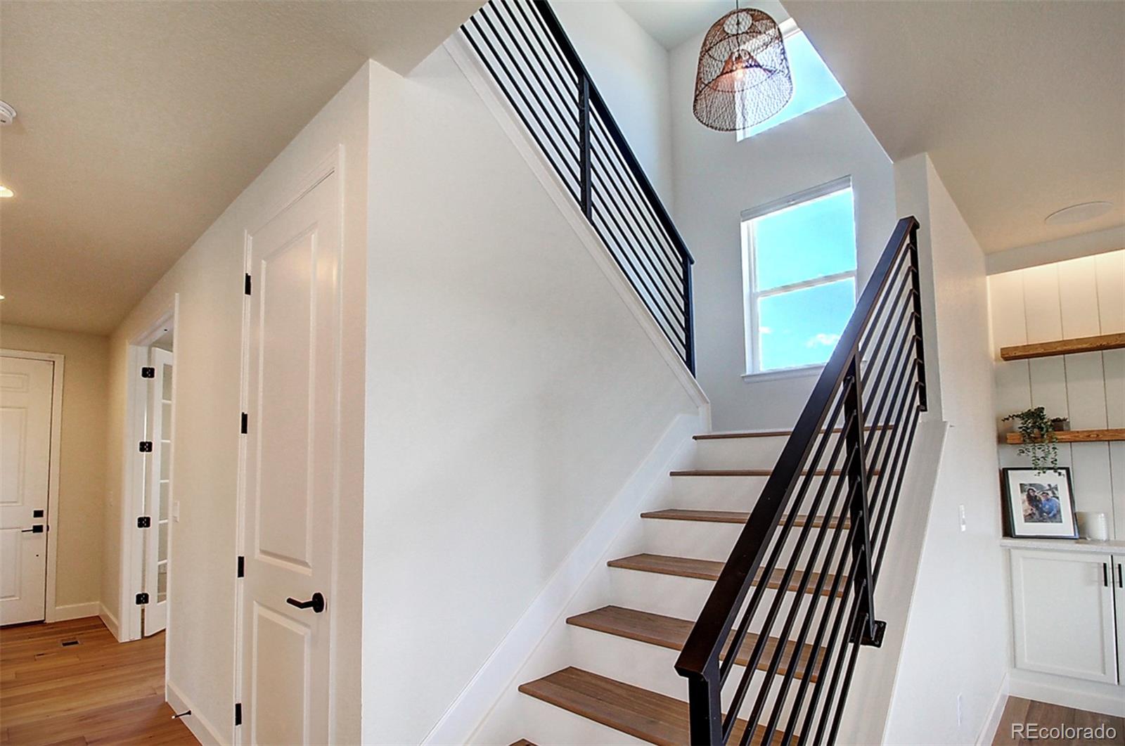 1013 Gabriella Lane Berthoud, CO 80513 - Photo 16 of 39 a view of entryway with wooden floor