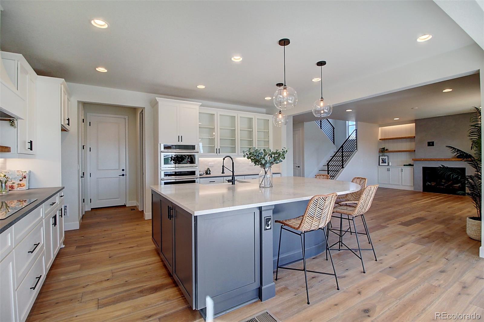 1013 Gabriella Lane Berthoud, CO 80513 - Photo 2 of 39 a kitchen with stainless steel appliances kitchen island granite countertop a sink and cabinets