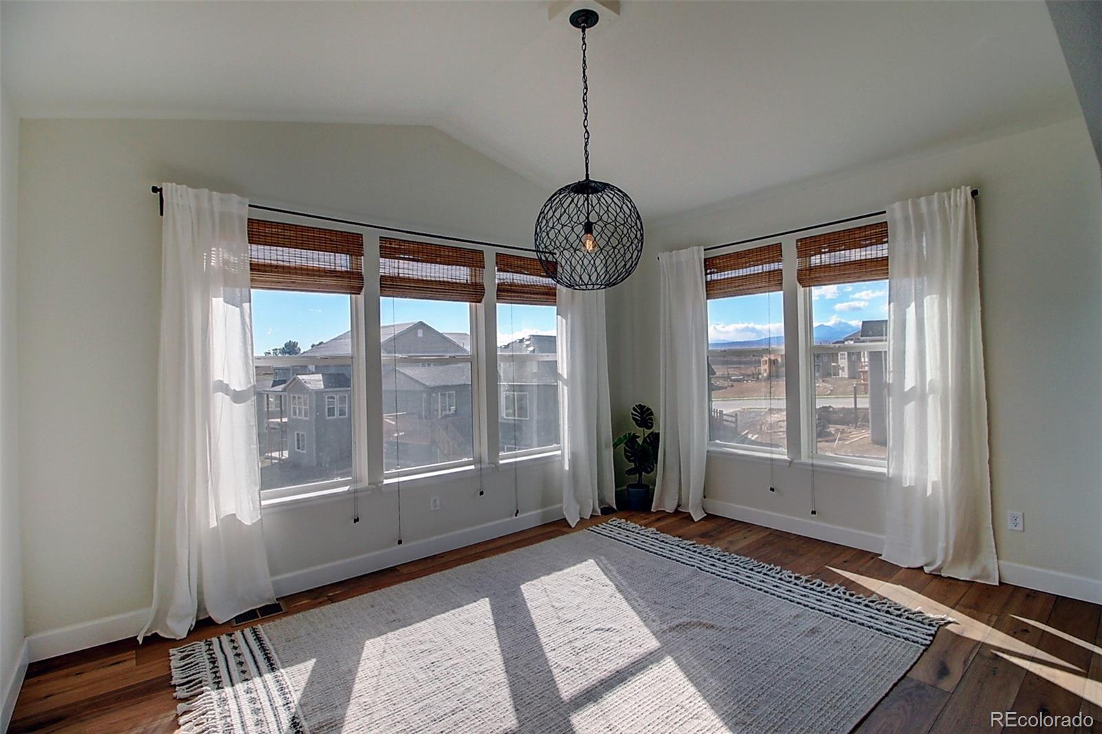 1013 Gabriella Lane Berthoud, CO 80513 - Photo 9 of 39 a view of an empty room with a window