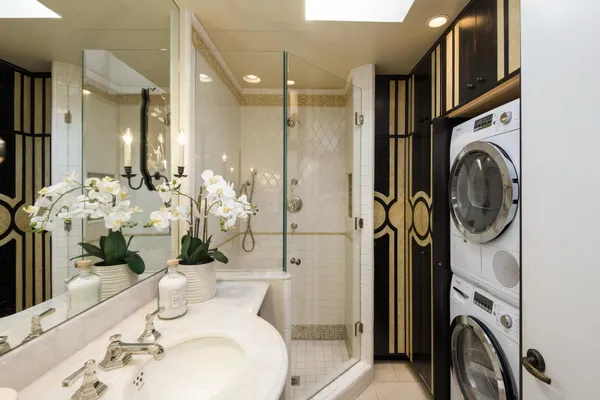 a bathroom with a sink a mirror and shower