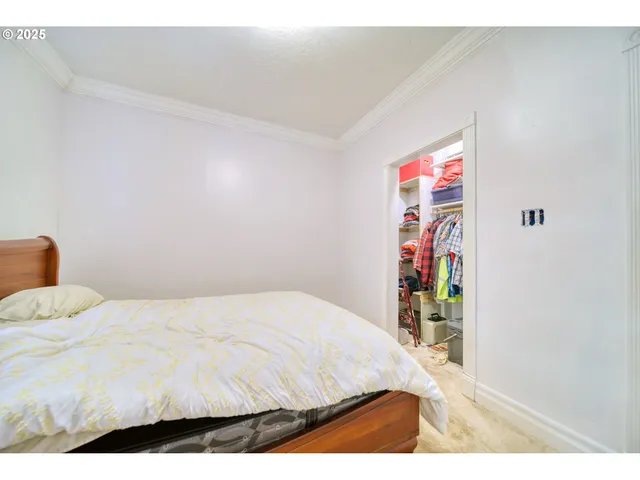 a bedroom with a bed and a table