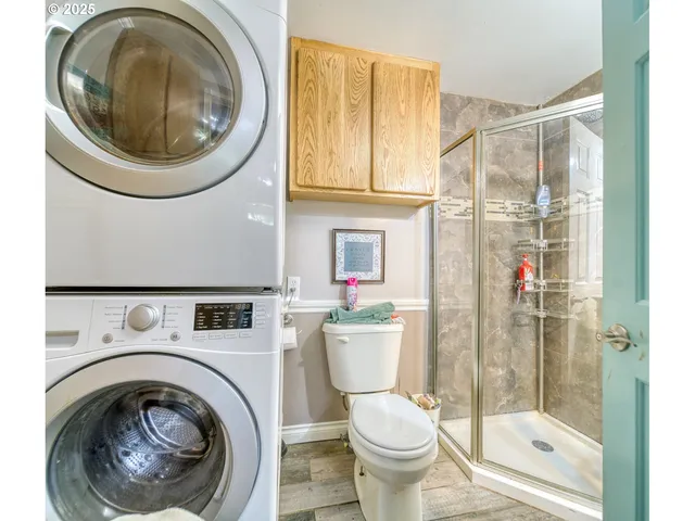 a bathroom with a sink a toilet and a shower