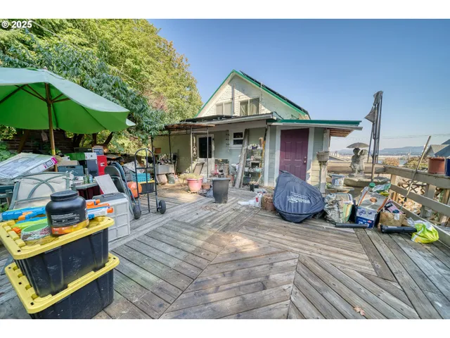 a view of a chairs and table in the patio of the house