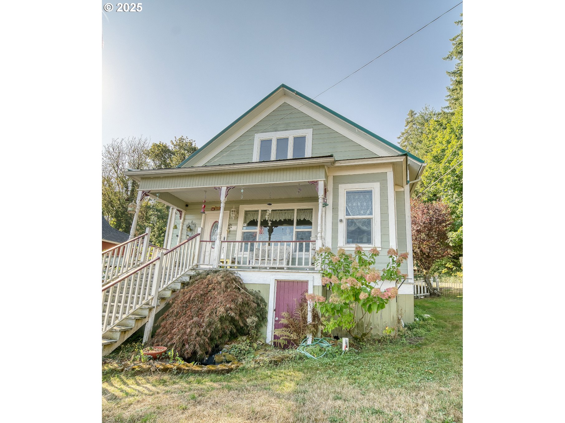 324 West F Street Rainier, OR 97048 - Photo 6 of 25 a front view of a house with garden