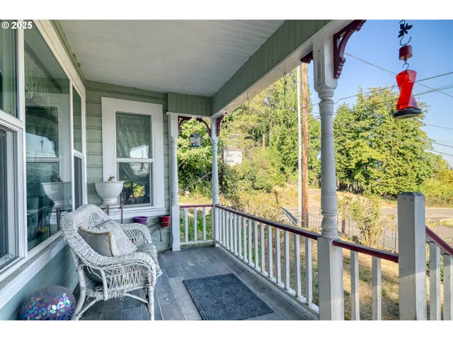 a porch with outdoor seating