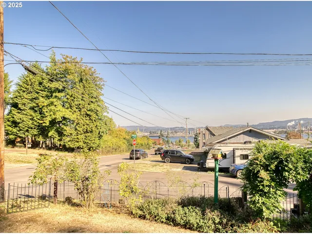 a view of a patio with table and chairs and potted plants