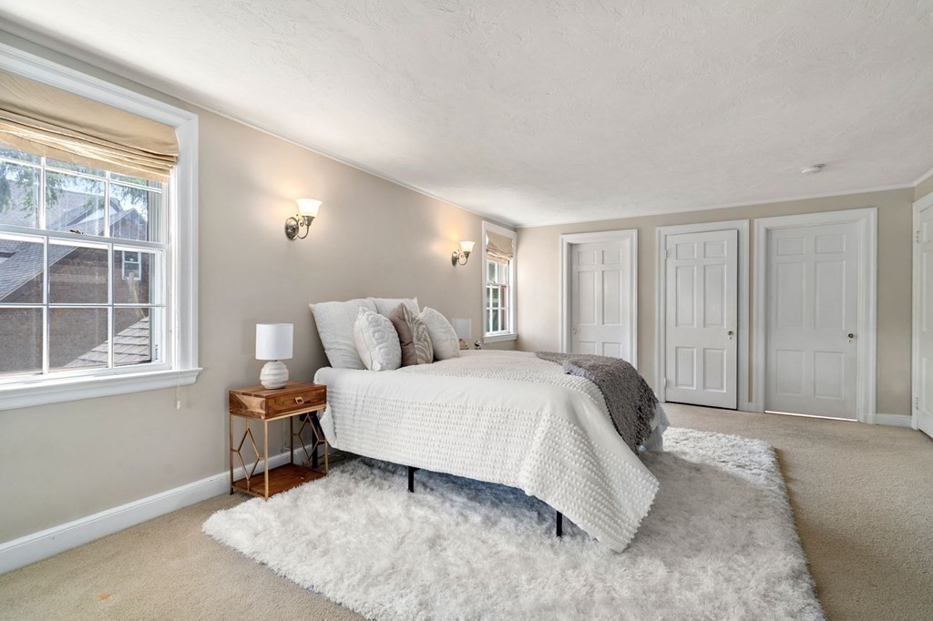 23 Ashford Road Newton, MA 02459 - Photo 17 of 35 a spacious bedroom with a bed and a window