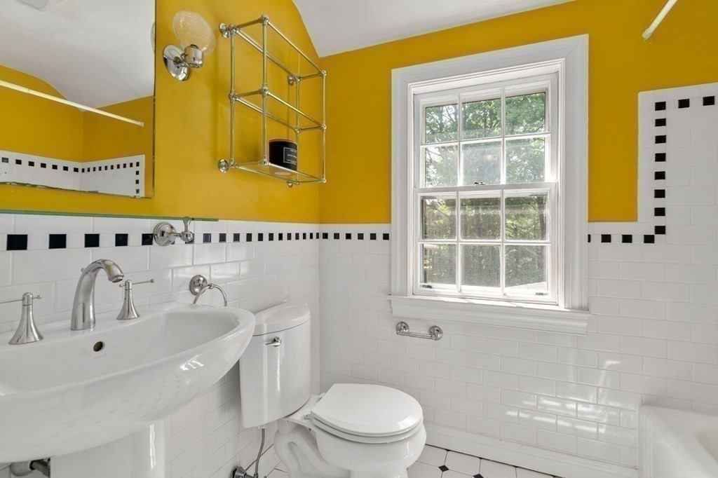 23 Ashford Road Newton, MA 02459 - Photo 18 of 35 a bathroom with a sink a toilet and shower